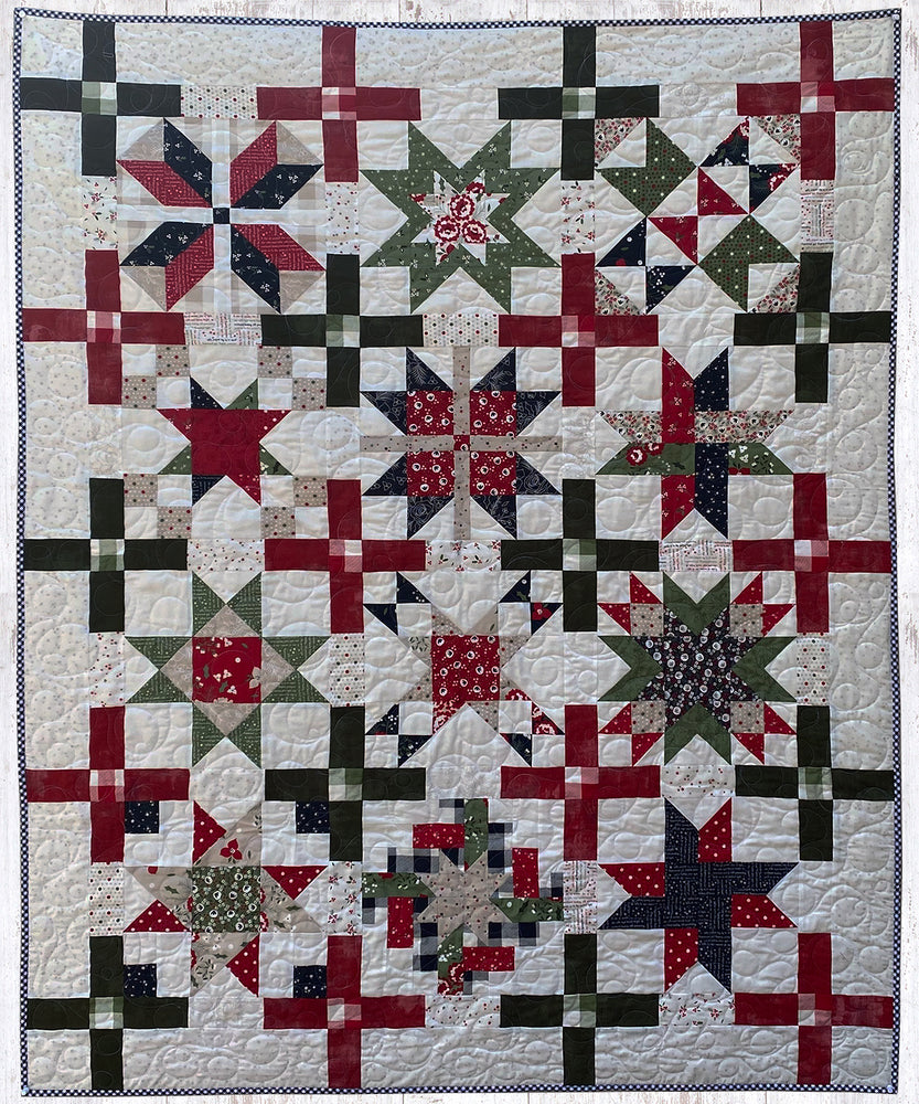 Christmas Stars Throw Quilt with festive patchwork design