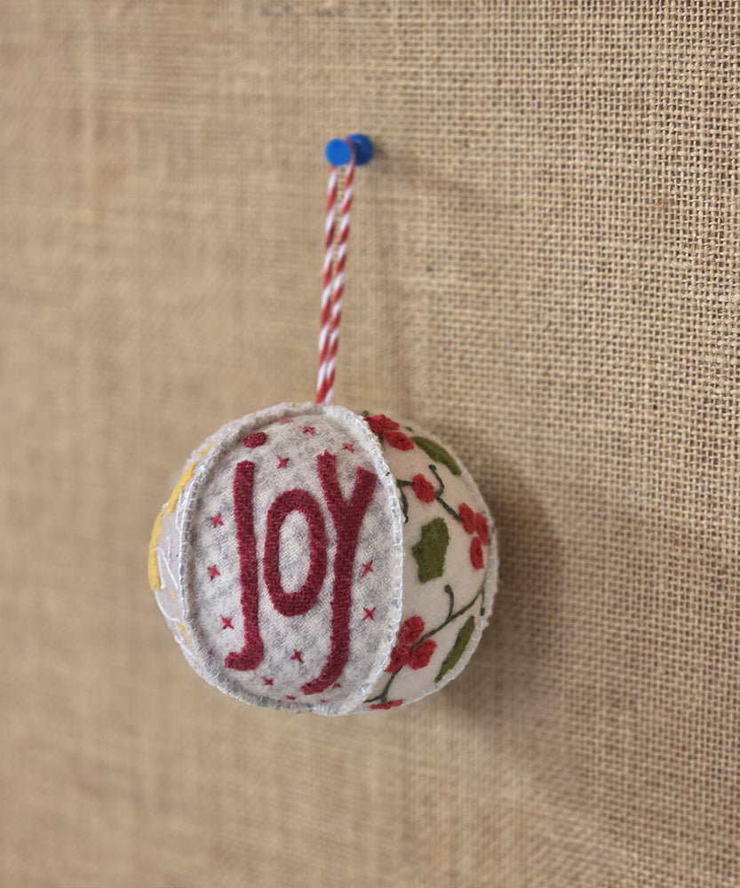 Joyful Christmas Bauble pattern by Hatched & Patched featuring wool appliqué Christmas designs
