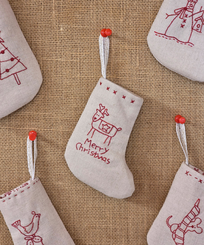Mini Merry Stockings with redwork stitchery Christmas designs by Natalie Bird