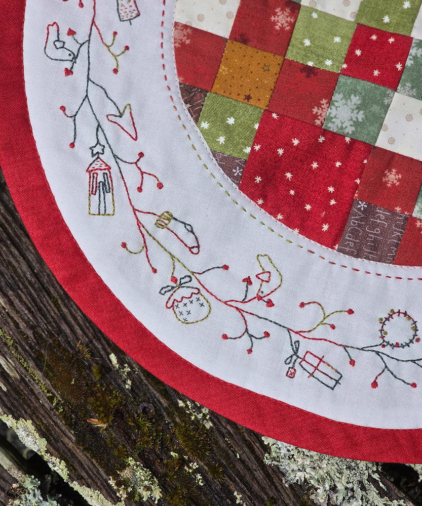 Noelle Tabletopper pattern featuring festive stitchery and appliqué by Hatched & Patched