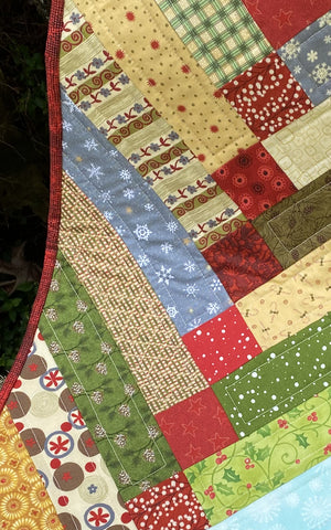 
                  
                    Colorful Scrappy Christmas Table Runner with holiday-themed design.
                  
                