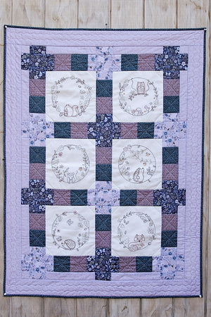 
                  
                    The Country Yard Forest Friends Quilt – Monthly quilting project with woodland-themed fabric and patterns.
                  
                